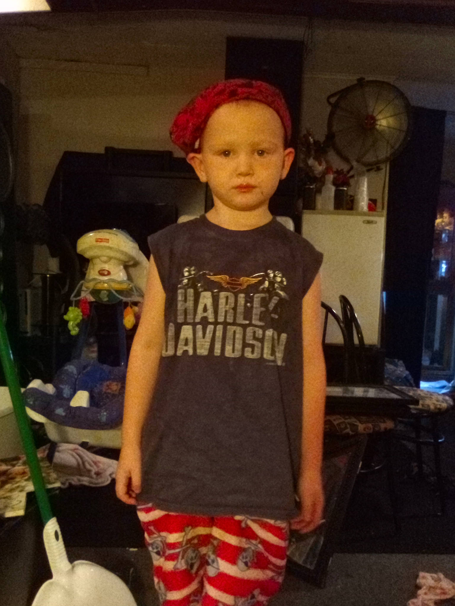 Levi is registered to the contest to win money with this photo: bag, cap, child, costume, fashion, fashion_accessory, fashion_design, fun, human_leg, person, room, shorts, shoulder, sleeve, sportswear, standing, street_fashion, t_shirt, thigh, toddler