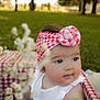 Charlotte joined the competition — help win amazing prizes! baby, child, headband, flower, red_and_white, checkered, basket, outdoor, grass, greenery, blurred_flowers, curious, cute, infant, portrait, summer, nature, white_clothing, soft_light, closeup
