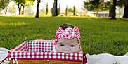 Charlotte is registered to the contest to win money with this photo: baby, basket, headband, picnic, blanket, flowers, watermelon, grass, trees, outdoor, daylight, nature, child, greenery, cute, wicker, summer, park, head, infant
