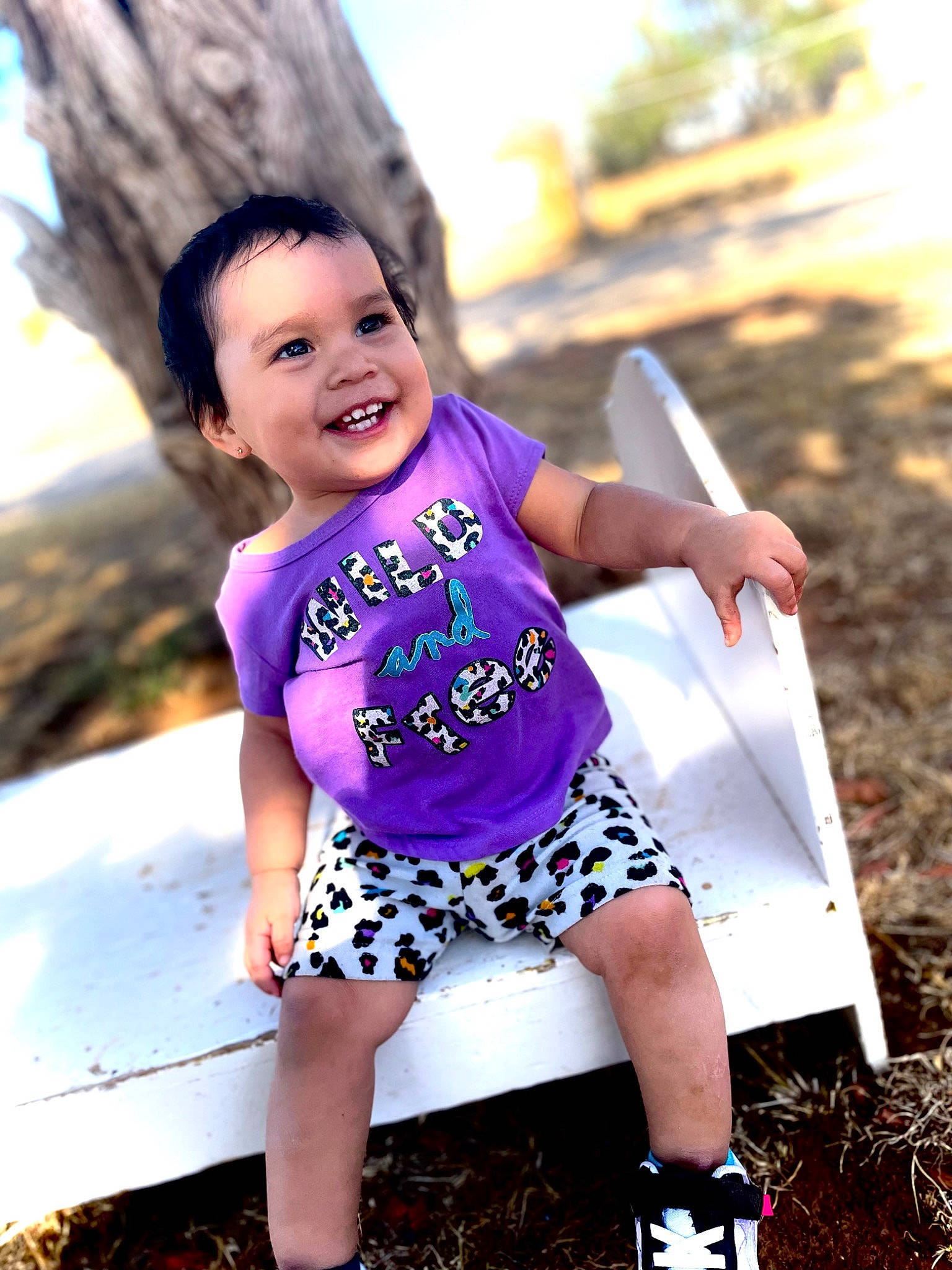Laila is registered to the contest to win money with this photo: child, flash_photography, fun, grass, happy, human_leg, joy, leisure, people_in_nature, person, photograph, pink, plant, purple, recreation, smile, summer, sunlight, t_shirt, toddler