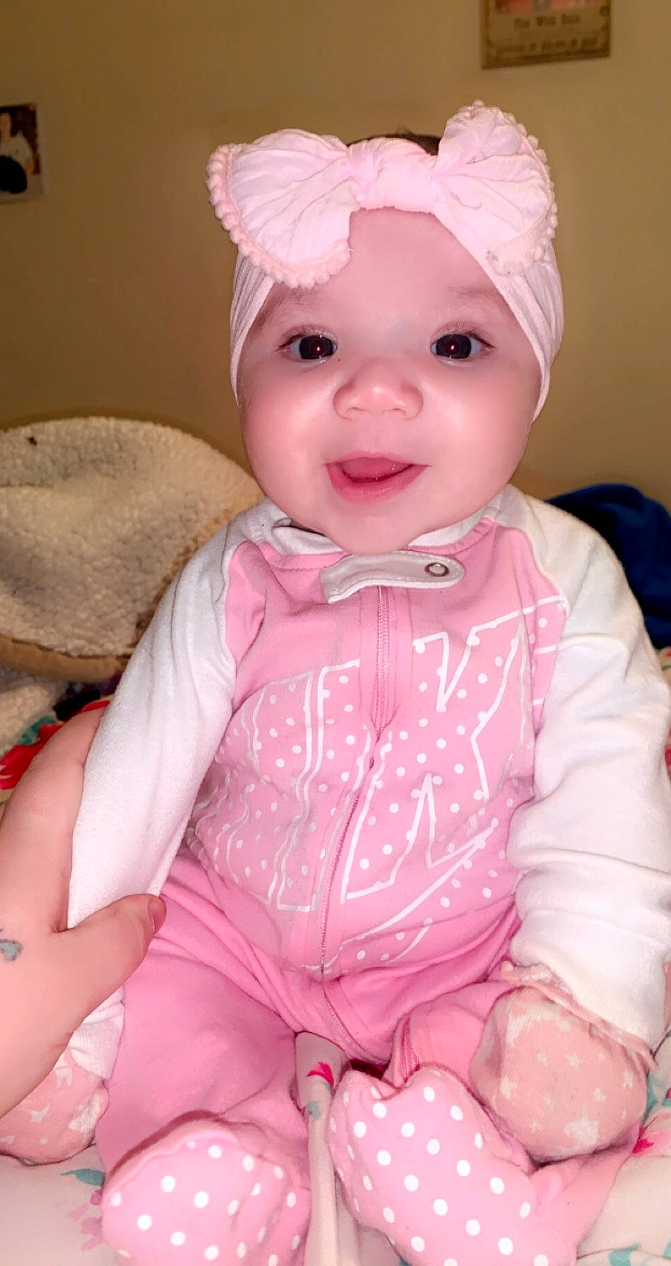 Hermione is registered to the contest to win money with this photo: baby, baby_toddler_clothing, cheek, child, dress, eye, eyelash, face, happy, headgear, headwear, iris, lip, magenta, person, pink, skin, sleeve, smile, textile