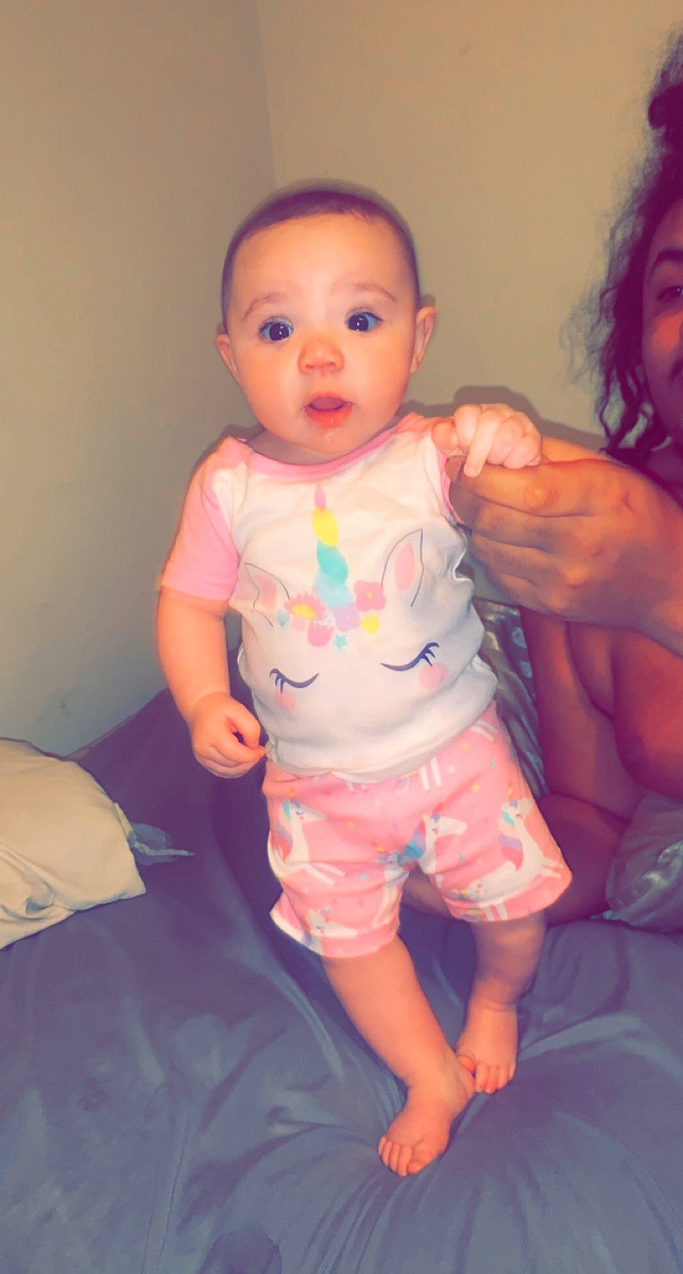 Hermione is registered to the contest to win money with this photo: baby_toddler_clothing, cheek, chin, eyebrow, face, finger, gesture, happy, human_body, iris, joint, leg, lip, mouth, neck, nose, person, pink, shoulder, skin