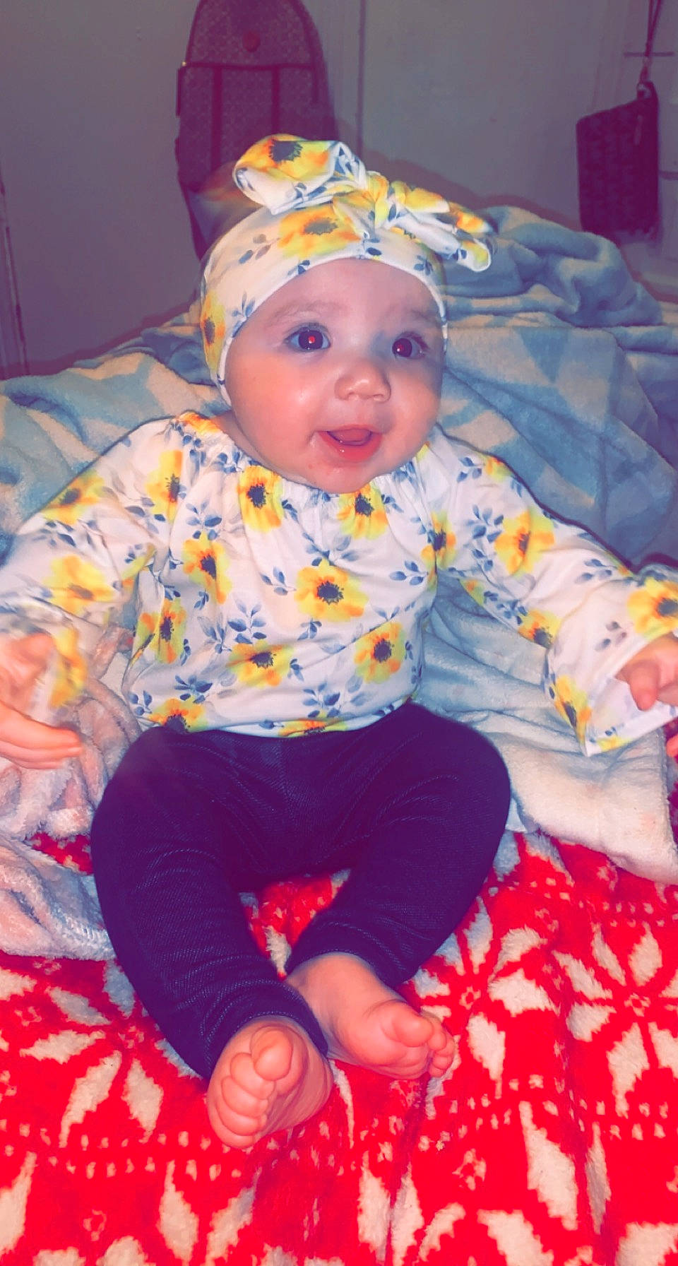 Hermione is registered to the contest to win money with this photo: baby, baby_toddler_clothing, blue, cheek, child, eye, fun, happy, head, headwear, human_body, iris, mouth, people, person, pink, purple, red, sleeve, smile