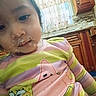 Alisson Abril is registered to the contest to win money with this photo: cabinet, child, closeup, clothing, countertop, cupboard, curtain, cute, face, food_on_face, indoor, kitchen, messy_face, pajamas, patrick, portrait, sink, spongebob, striped_shirt, toddler