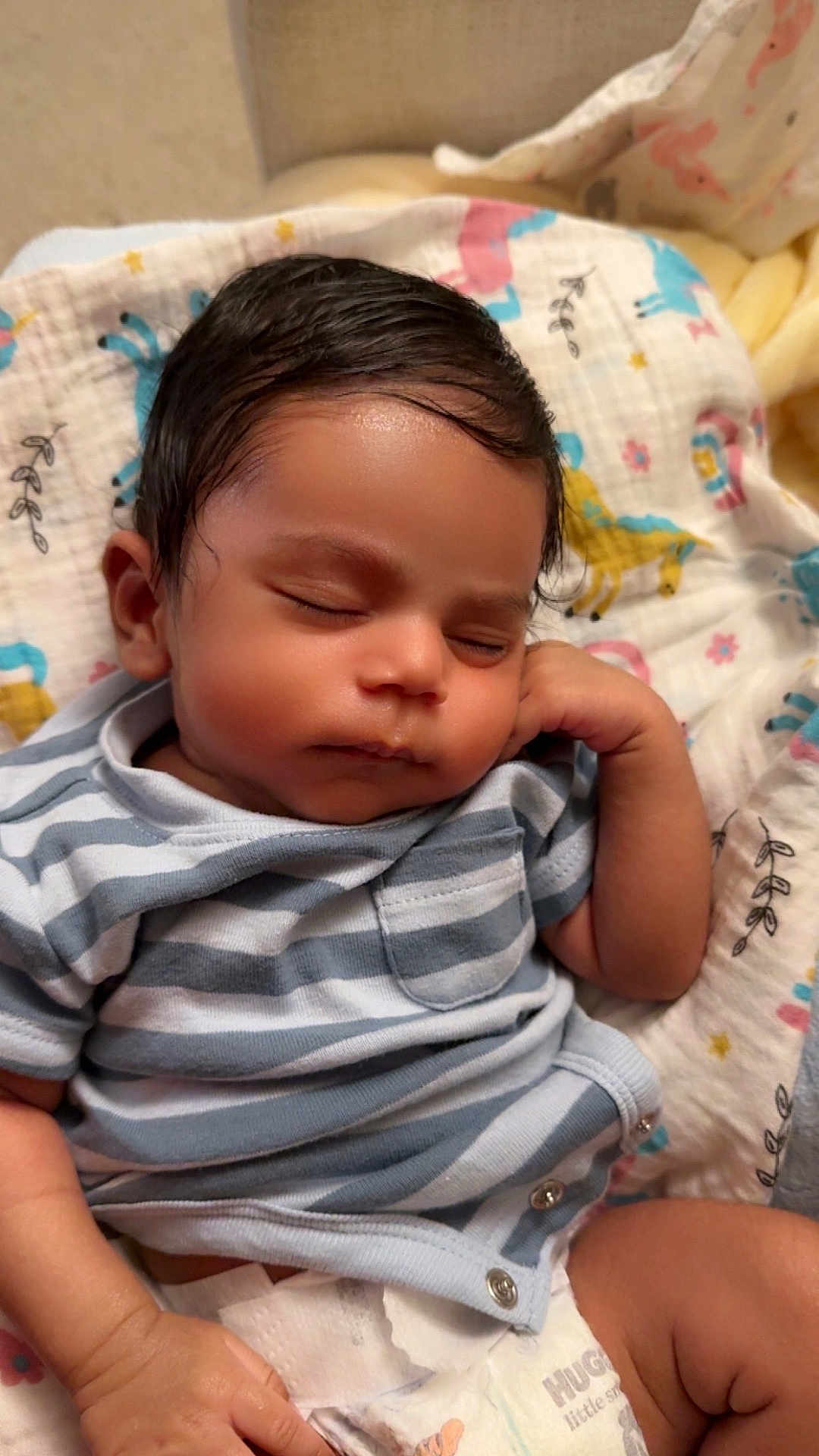 Vikranth joined the competition — help win amazing prizes! baby, sleeping, infant, striped_shirt, diaper, blanket, peaceful, cute, child, face, hand, resting, indoors, soft_lighting, closeup, newborn, portrait, relaxed, toddler, comfort