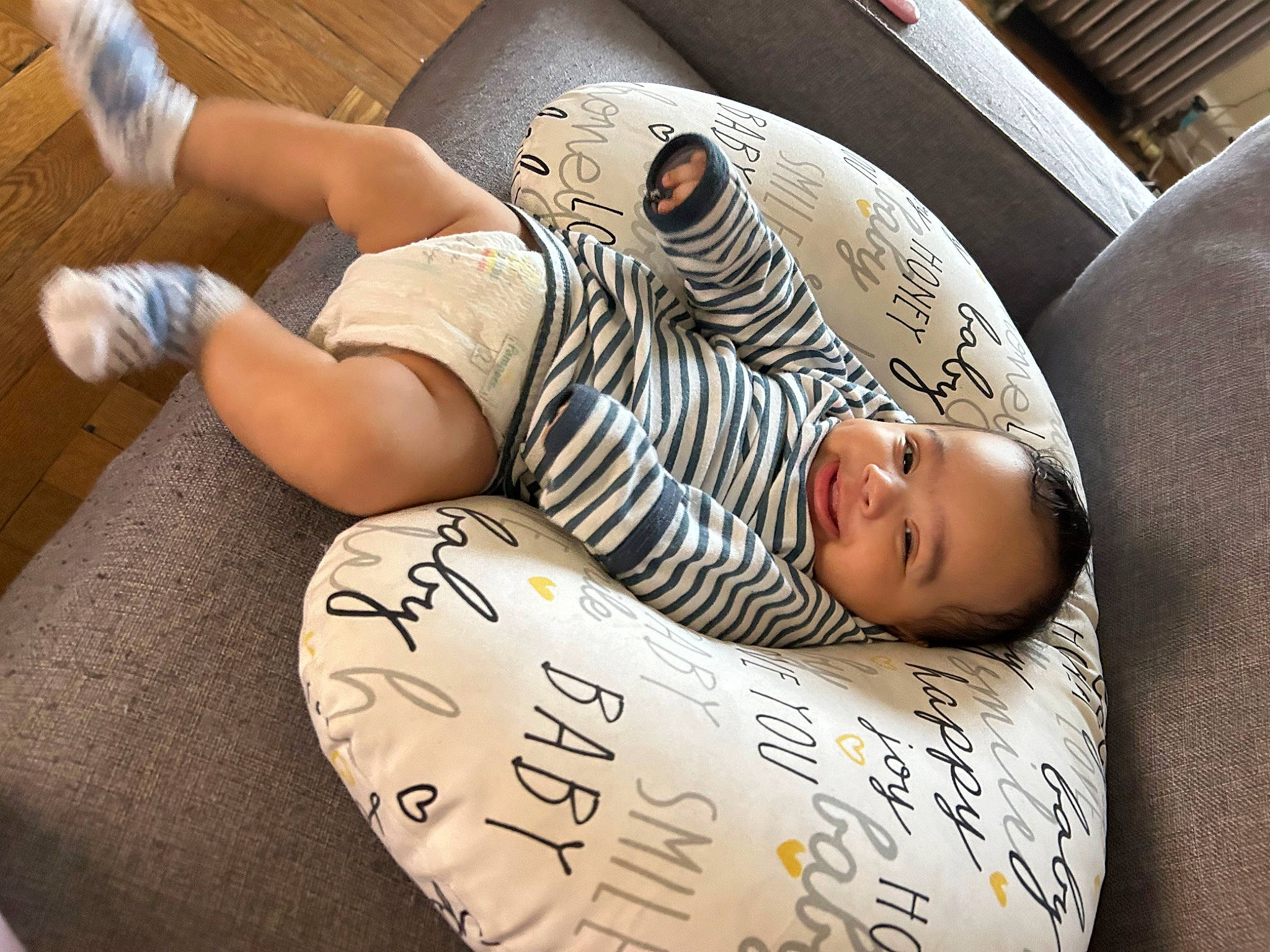 Zamari is registered to the contest to win money with this photo: baby, barefoot, child, comfort, elbow, flesh, flooring, foot, fun, human_leg, knee, leg, linens, nap, person, room, sitting, sleep, sock, thigh