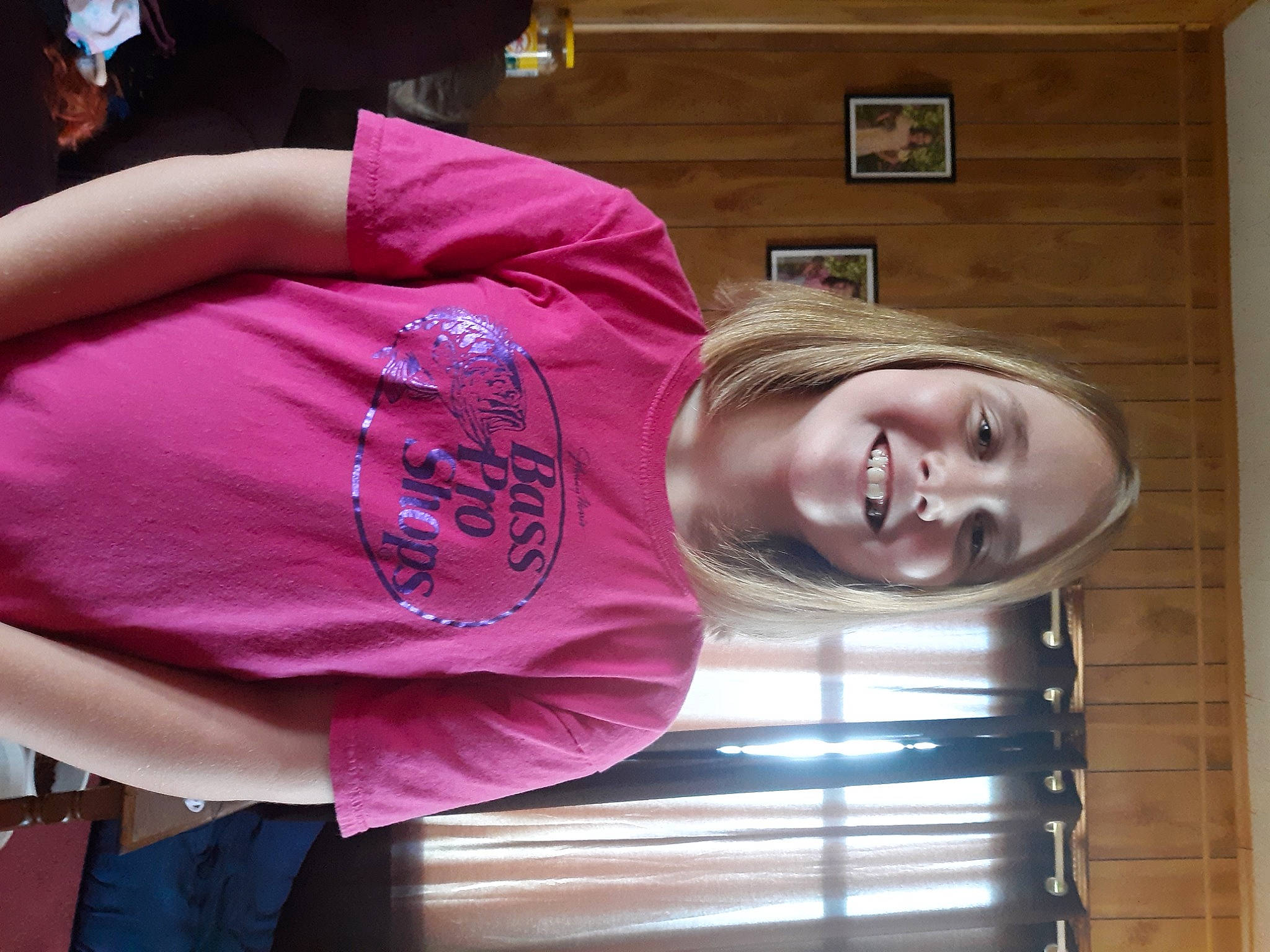 Isabella is registered to the contest to win money with this photo: abdomen, child, comfort, elbow, fun, joy, magenta, mammal, person, picture_frame, purple, room, sleeve, smile, t_shirt, thigh, tree, wood