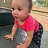 Samiyah joined the competition — help win amazing prizes! baby, child, toddler, curly_hair, outdoor, playground, picnic_table, crawling, sitting, pink_shirt, patterned_pants, smiling, surprised, face, hands, eyes, park, playground_equipment, daylight, portrait