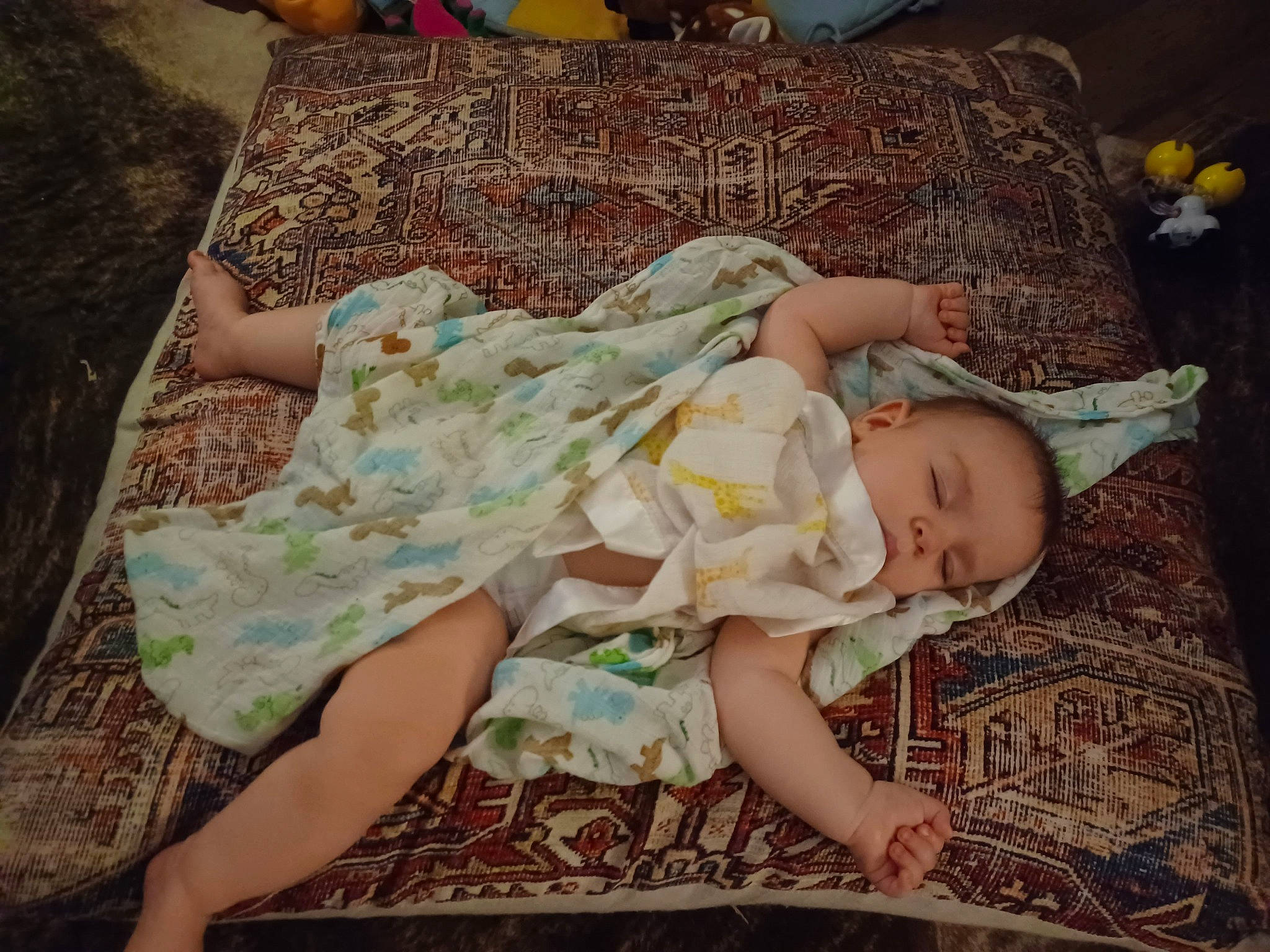 Jacob is registered to the contest to win money with this photo: baby, baby_products, baby_toddler_clothing, cheek, child, comfort, eye, foot, human_leg, lap, linens, pattern, person, room, sitting, skin, textile, thigh, toddler, vintage_clothing