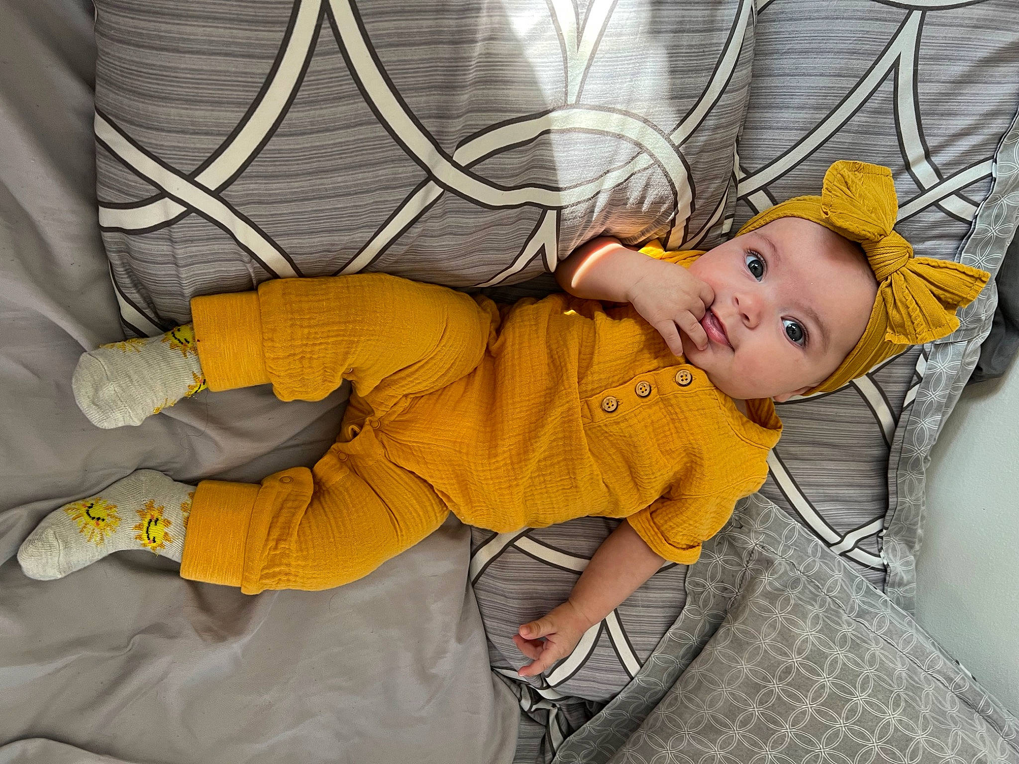 Kahlani joined the competition — help win amazing prizes! baby, baby_products, baby_toddler_clothing, chair, child, comfort, flooring, fun, grass, headgear, human_leg, knee, linens, nap, pattern, person, personal_protective_equipment, sitting, sleep, toddler