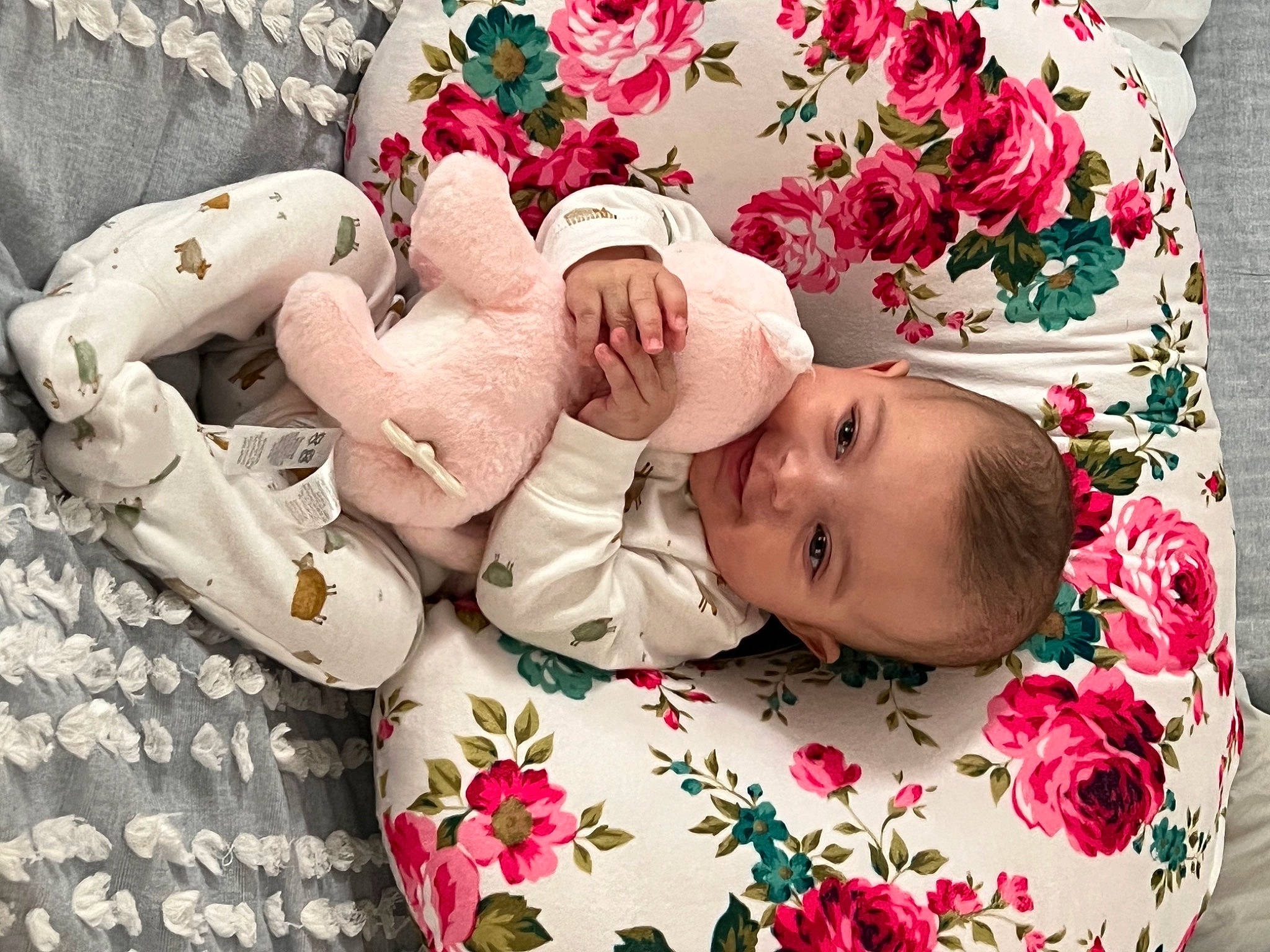 Kahlani is registered to the contest to win money with this photo: baby, baby_products, baby_sleeping, baby_toddler_clothing, cheek, child, comfort, face, facial_expression, flower, happy, head, linens, pattern, person, petal, pink, product, skin, textile