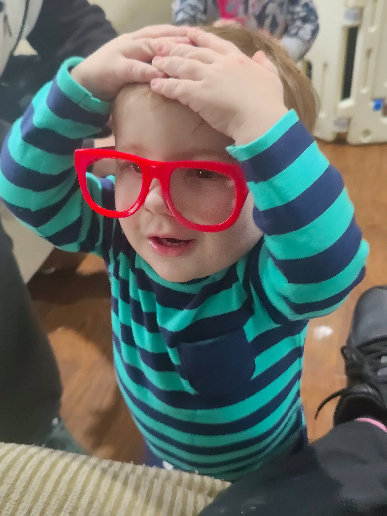 Braxton is registered to the contest to win money with this photo: cool, eyelash, eyewear, finger, fun, gesture, glasses, goggles, hand, happy, leisure, lip, nail, person, personal_protective_equipment, sleeve, smile, sunglasses, thumb, toddler