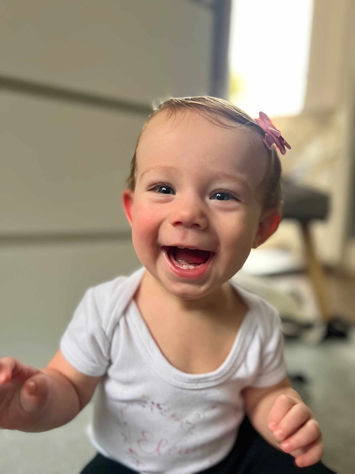 Eleanor joined the competition — help win amazing prizes! toddler, child, smiling, happy, face, hair_clip, indoor, white_shirt, cute, baby, portrait, laughing, skin, person, young_child, short_hair, cheerful, expression, infant, blurry_background