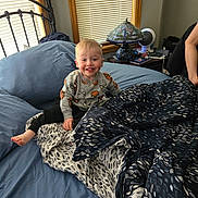 Kaiser joined the competition — help win amazing prizes! child, toddler, bed, blanket, pillow, lamp, window, blinds, smiling, sweater, spiderman, furniture, room, indoor, person, foot, hand, nightstand, book, fan