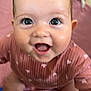 Nellie is registered to the contest to win money with this photo: baby, smiling, happy, child, infant, cute, eyes, face, sitting, blanket, toy, floor, indoors, clothing, pink, expression, person, skin, head, play