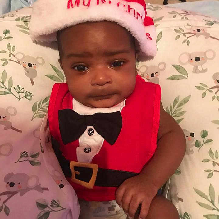 Zyair is registered to the contest to win money with this photo: baby, babylaughing, bonnet, cap, clothing, face, happy, hat, head, person, photography, portrait, sitting, smile