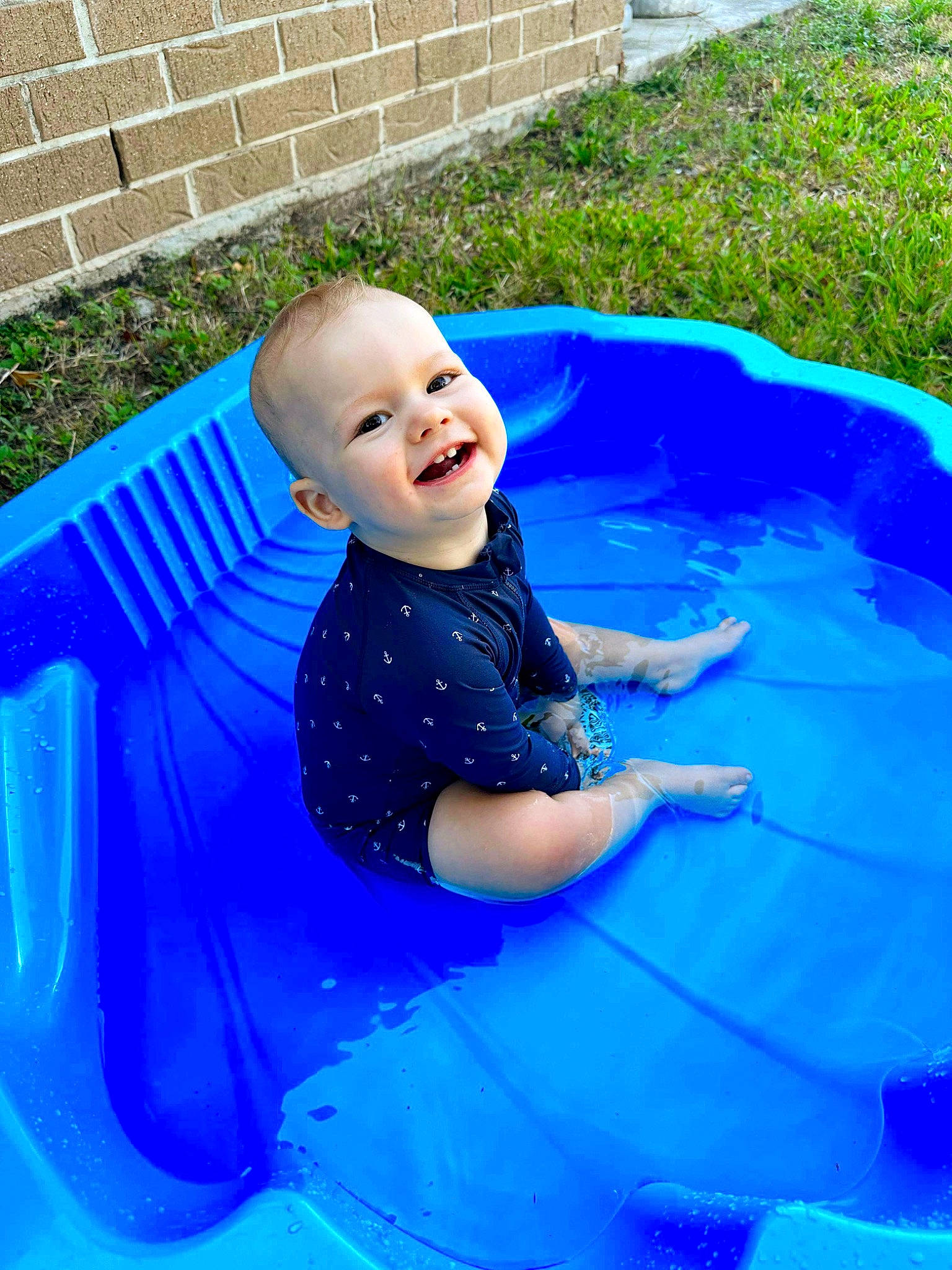 Bentley joined the competition — help win amazing prizes! aqua, baby, baby_laughing, baby_toddler_clothing, blue, child, electric_blue, fun, grass, happy, leisure, person, plant, play, product, recreation, sitting, smile, t_shirt, toddler
