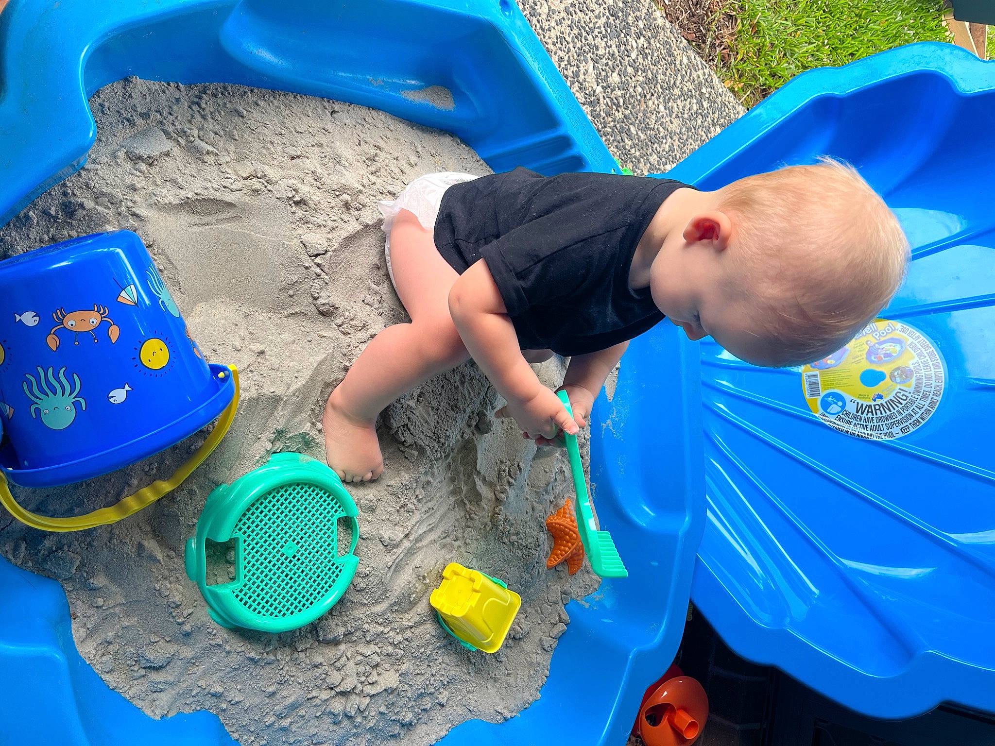 Bentley is registered to the contest to win money with this photo: baby, baby_products, baby_toys, blue, child, electric_blue, fun, green, hat, leisure, person, plastic, play, product, recreation, shorts, soil, t_shirt, toddler, toy