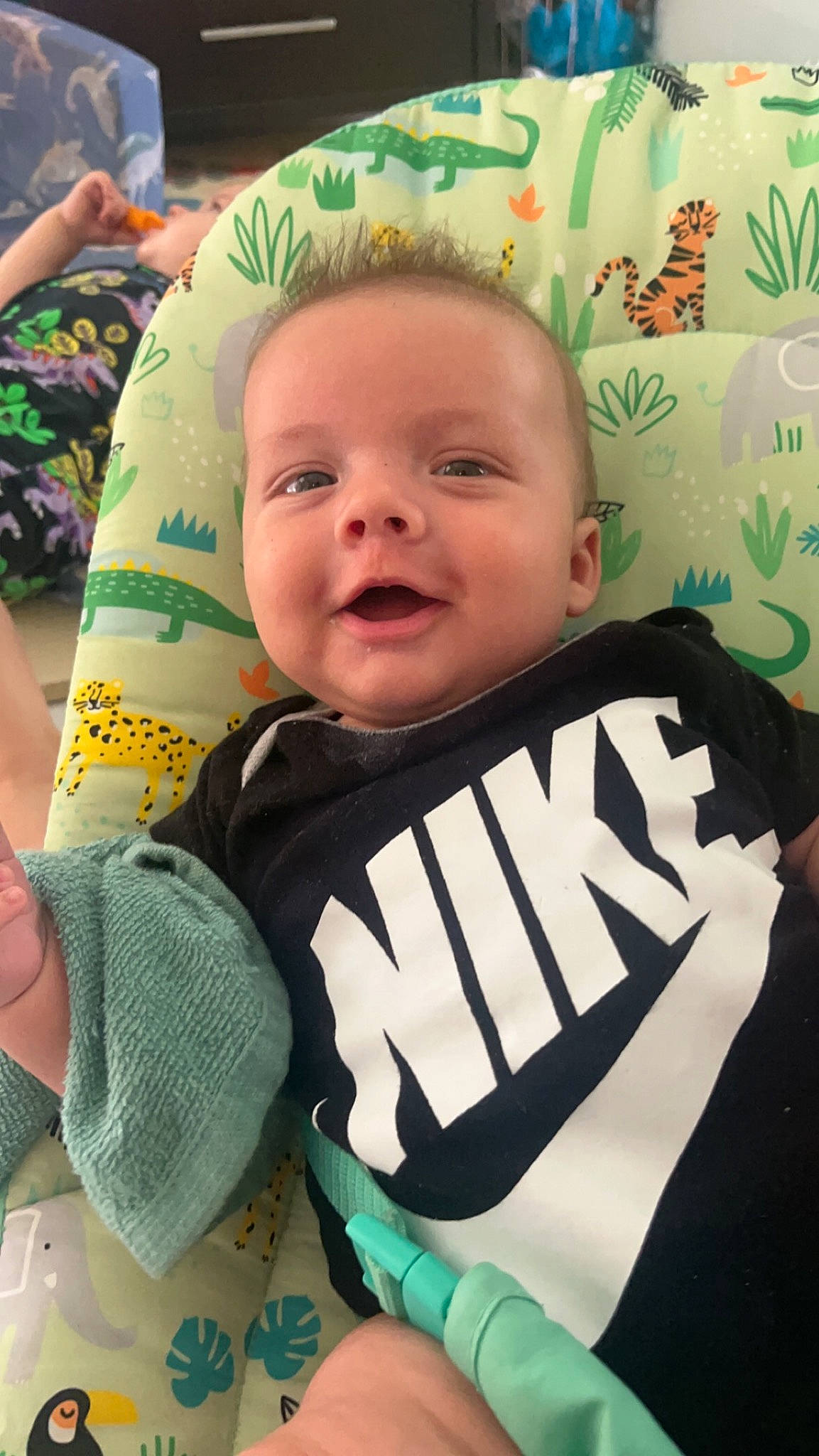 Jonah joined the competition — help win amazing prizes! baby, baby_products, baby_toddler_clothing, cheek, child, eyebrow, facial_expression, fun, grass, green, happy, head, jersey, linens, person, sitting, skin, sleeve, smile, textile