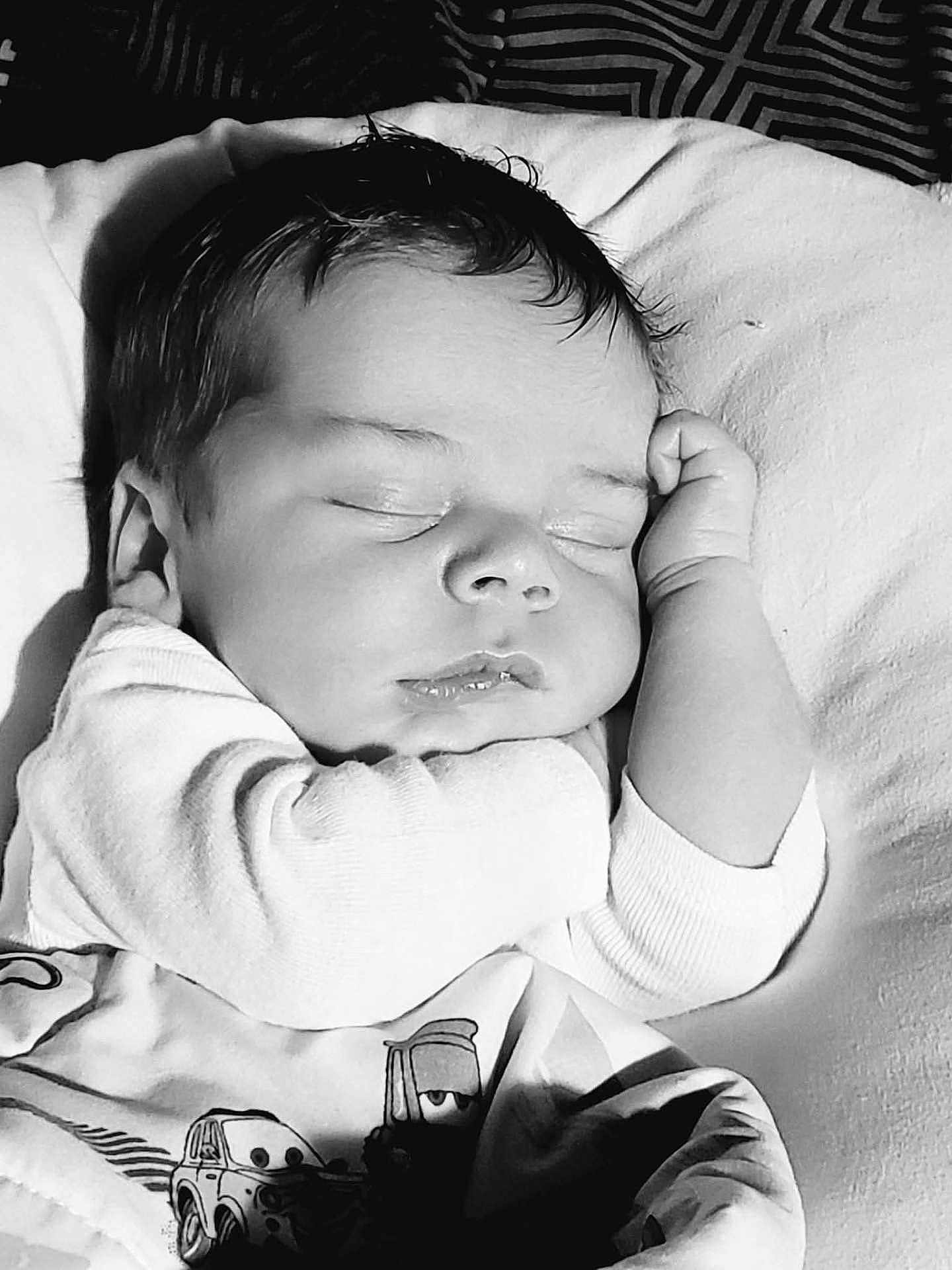 Michael is registered to the contest to win money with this photo: baby, sleeping, blanket, cartoon, child, infant, face, hand, peaceful, cozy, monochrome, portrait, rest, soft, cute, clothing, indoors, closeup, toddler, nap