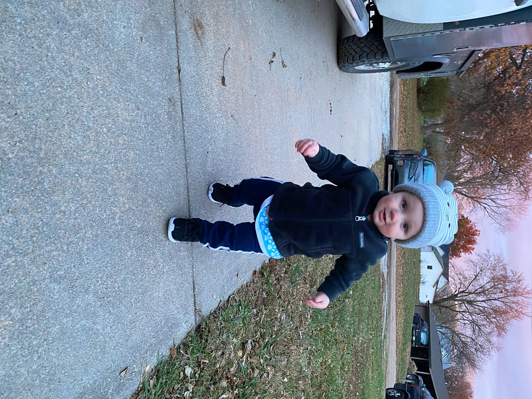 Brentley joined the competition — help win amazing prizes! adventure, asphalt, concrete, electric_blue, fun, headwear, leisure, outdoor_shoe, person, plant, recreation, road_surface, shadow, sidewalk, smile, tar, toddler, tree, walking_shoe, winter