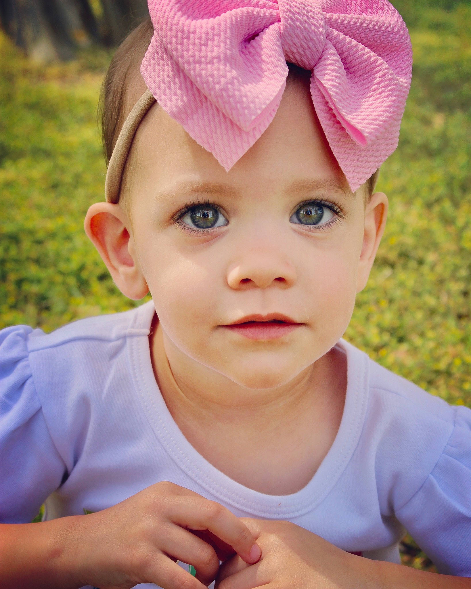 Jayda is registered to the contest to win money with this photo: baby_toddler_clothing, cheek, child, chin, ear, eye, eyelash, finger, forehead, headgear, headwear, lip, magenta, mouth, nail, nose, organ, person, pink, skin