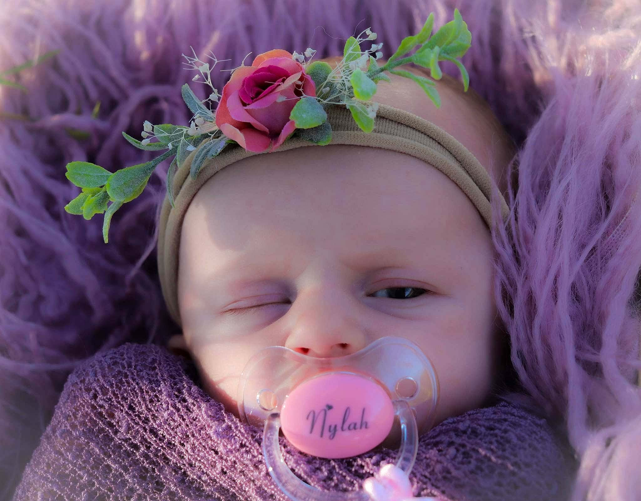 Nylah joined the competition — help win amazing prizes! baby, baby_toddler_clothing, beauty, cheek, costume_hat, eyelash, flower, grass, happy, headband, headpiece, headwear, iris, magenta, person, petal, pink, plant, purple, skin