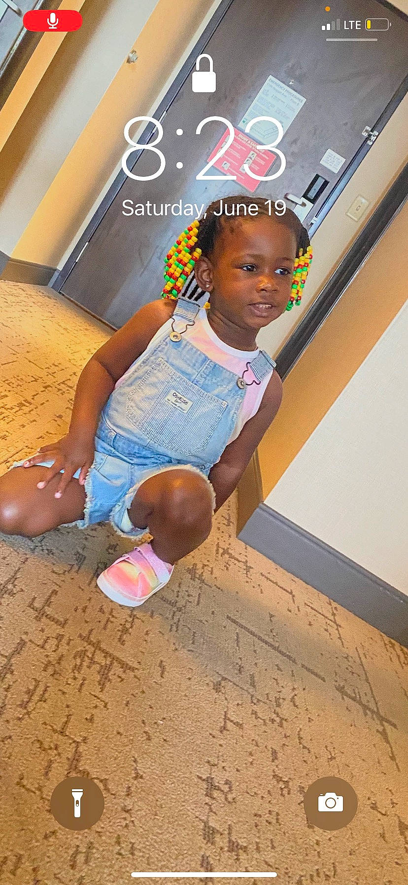 Kalayah is registered to the contest to win money with this photo: advertising, barefoot, child, flooring, foot, fun, happy, human_leg, leisure, logo, person, play, recreation, room, sitting, soil, t_shirt, thigh, vacation, water