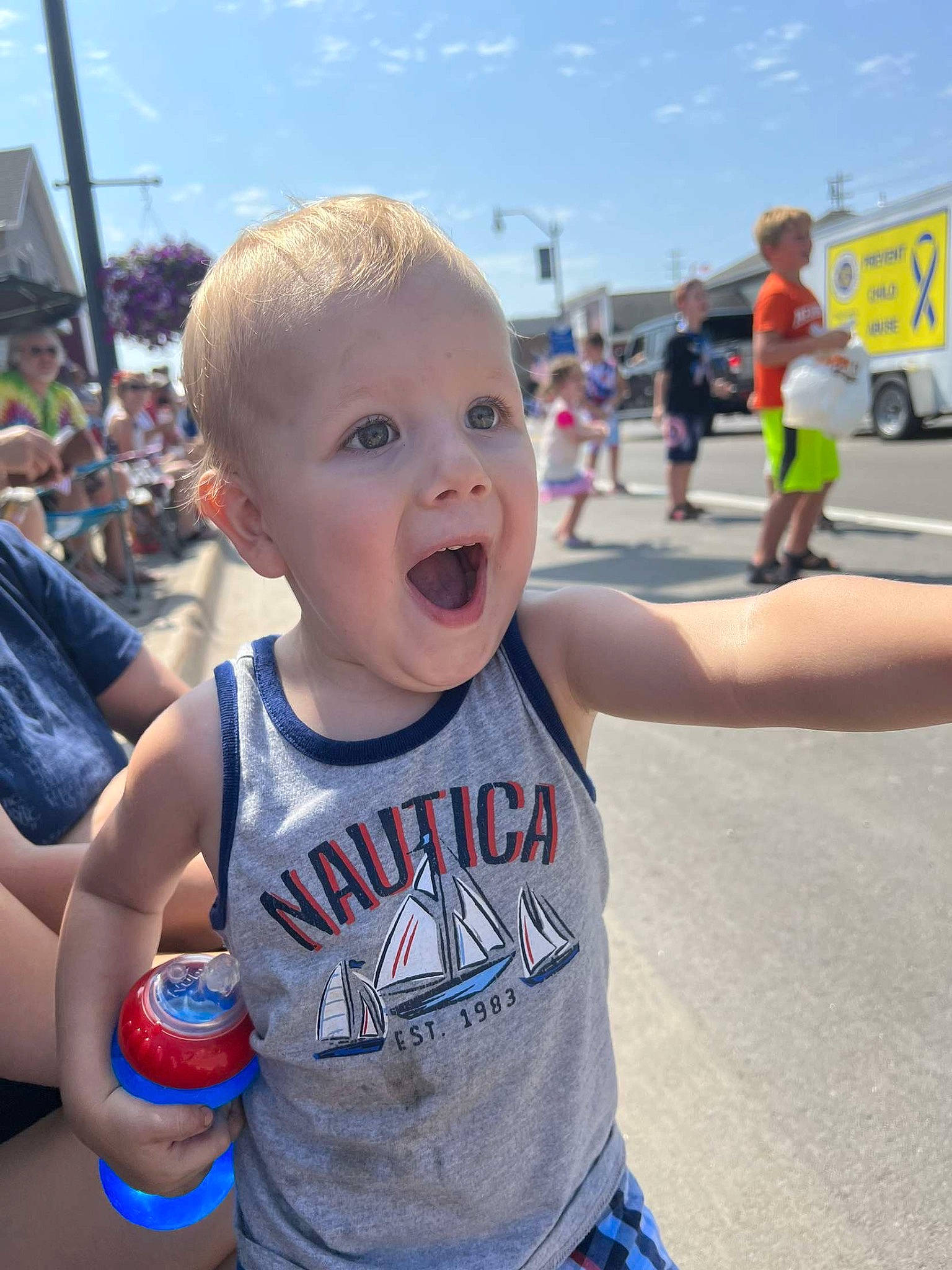 Oaklee is registered to the contest to win money with this photo: asphalt, baby, blue, blurred, child, cloud, cool, daytime, event, fun, gesture, happy, leisure, muscle, person, recreation, road, sky, smile, summer