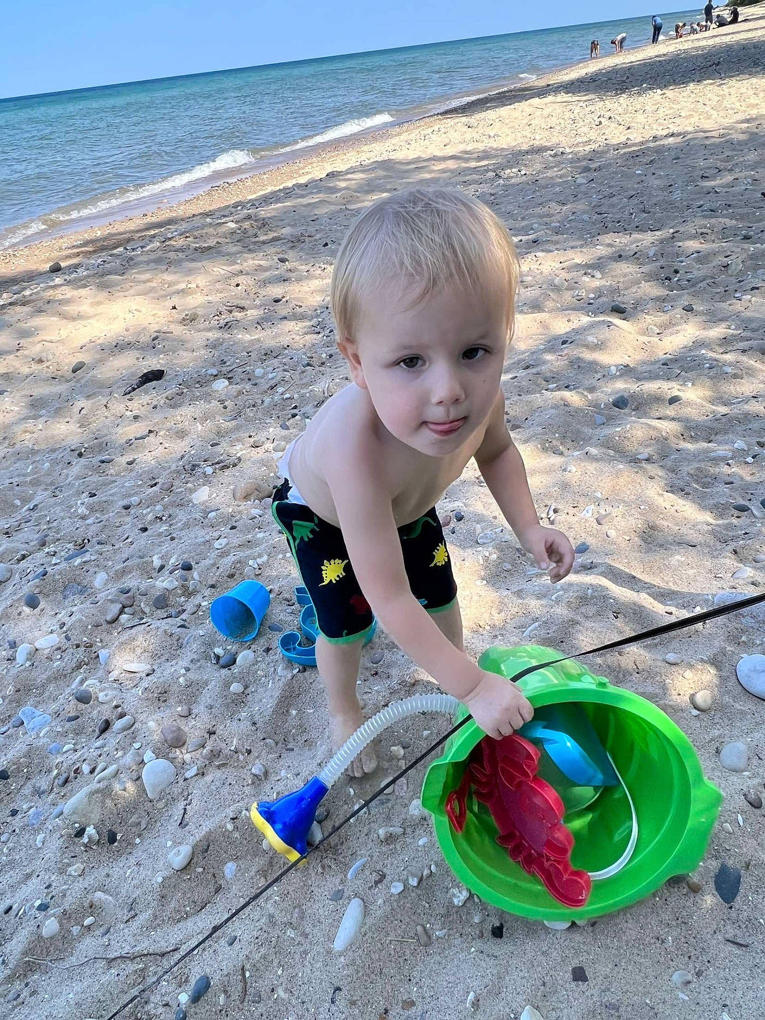 Oaklee is registered to the contest to win money with this photo: beach, blue, child, coast, electric_blue, fun, happy, leisure, natural_environment, ocean, people_in_nature, person, play, recreation, sand, shore, sky, smile, summer, toddler