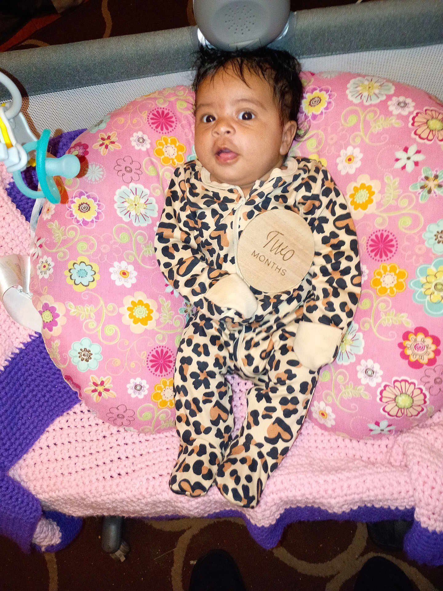 Daliha joined the competition — help win amazing prizes! baby, infant, onesie, leopard_print, pillow, floral_pattern, crocheted_blanket, pink, purple, face, person, clothing, indoor, carpet, cute, newborn, child, lying_down, wide_eyes, baby_toy