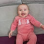 Louna participe au concours pour gagner de l'argent avec cette photo : baby, infant, pink_onesie, bunny_print, smiling, happy, sitting, couch, furniture, child, cute, portrait, indoor, person, head, face, clothing, young_child, hands, legs