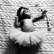 Madyson participe au concours pour gagner de l'argent avec cette photo : accessory, baby, black_and_white, blanket, child, clothing, curious, cute, face, foot, hand, headband, indoors, infant, lying_down, pacifier, portrait, soft_texture, toddler, tutu