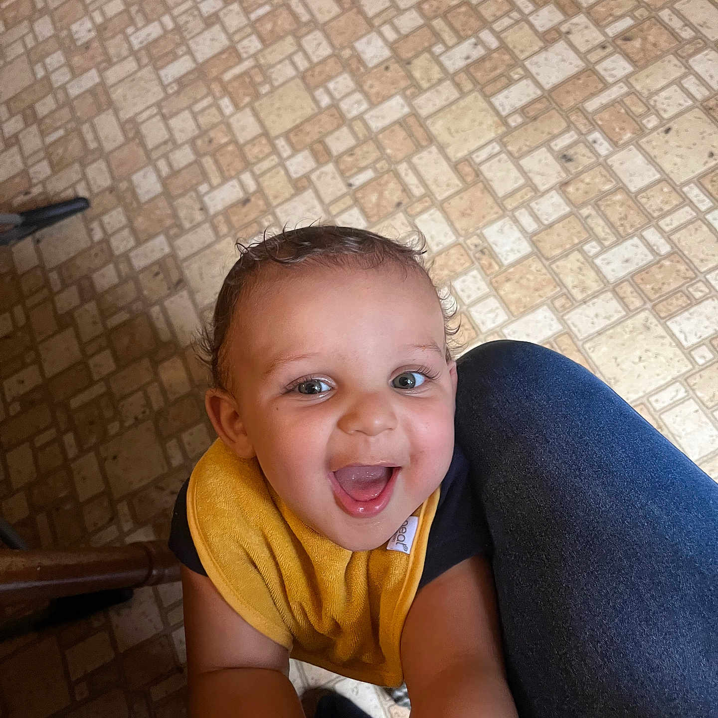 Nolan Drake is registered to the contest to win money with this photo: baby, babylaughing, bodypart, clothing, couch, face, furniture, happy, head, laughing, mouth, pants, person, photography, portrait, sitting, smile, t_shirt, teeth, tile