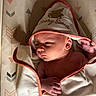 Adaline is registered to the contest to win money with this photo: arrows_pattern, baby, beary_sweet, blanket, cozy, cute, face, gaze, hand, hood, indoors, infant, newborn, orange_trim, portrait, resting, skin, soft_texture, towel, wrapped