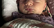 Adaline joined the competition — help win amazing prizes! baby, blanket, child, closeup, clothing, cozy, cute, face, head, indoors, infant, newborn, peaceful, portrait, resting, skin, sleeping, soft_lighting, toddler, wrapped
