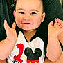 baby, child, birthday, clapping, smiling, mickey_mouse, shirt, person, cute, happy, hands, face, infant, celebration, casual_clothing, indoor, adult, holding, portrait, cheerful