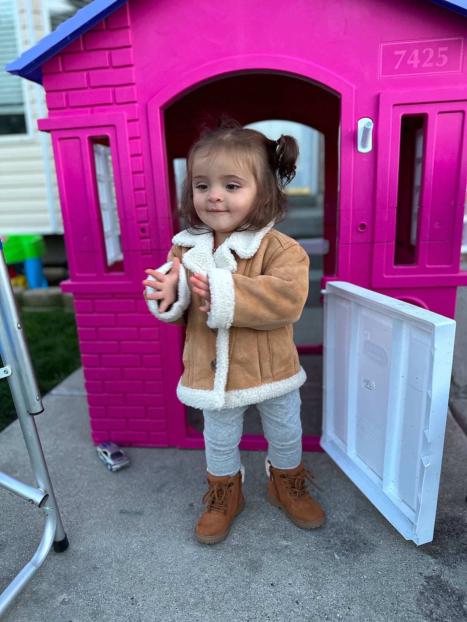 Oaklee is registered to the contest to win money with this photo: boot, building, child, city, door, fun, happy, jacket, joy, leisure, magenta, people, person, pink, play, playhouse, purple, recreation, smile, snapshot