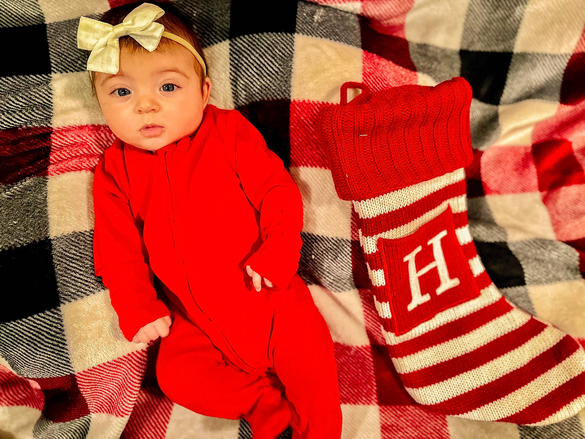 Hadlee joined the competition — help win amazing prizes! baby, baby_toddler_clothing, carmine, christmas, christmas_eve, costume_hat, event, face, headwear, holiday, linens, outerwear, pattern, person, plaid, product, sleeve, sock, textile, toddler