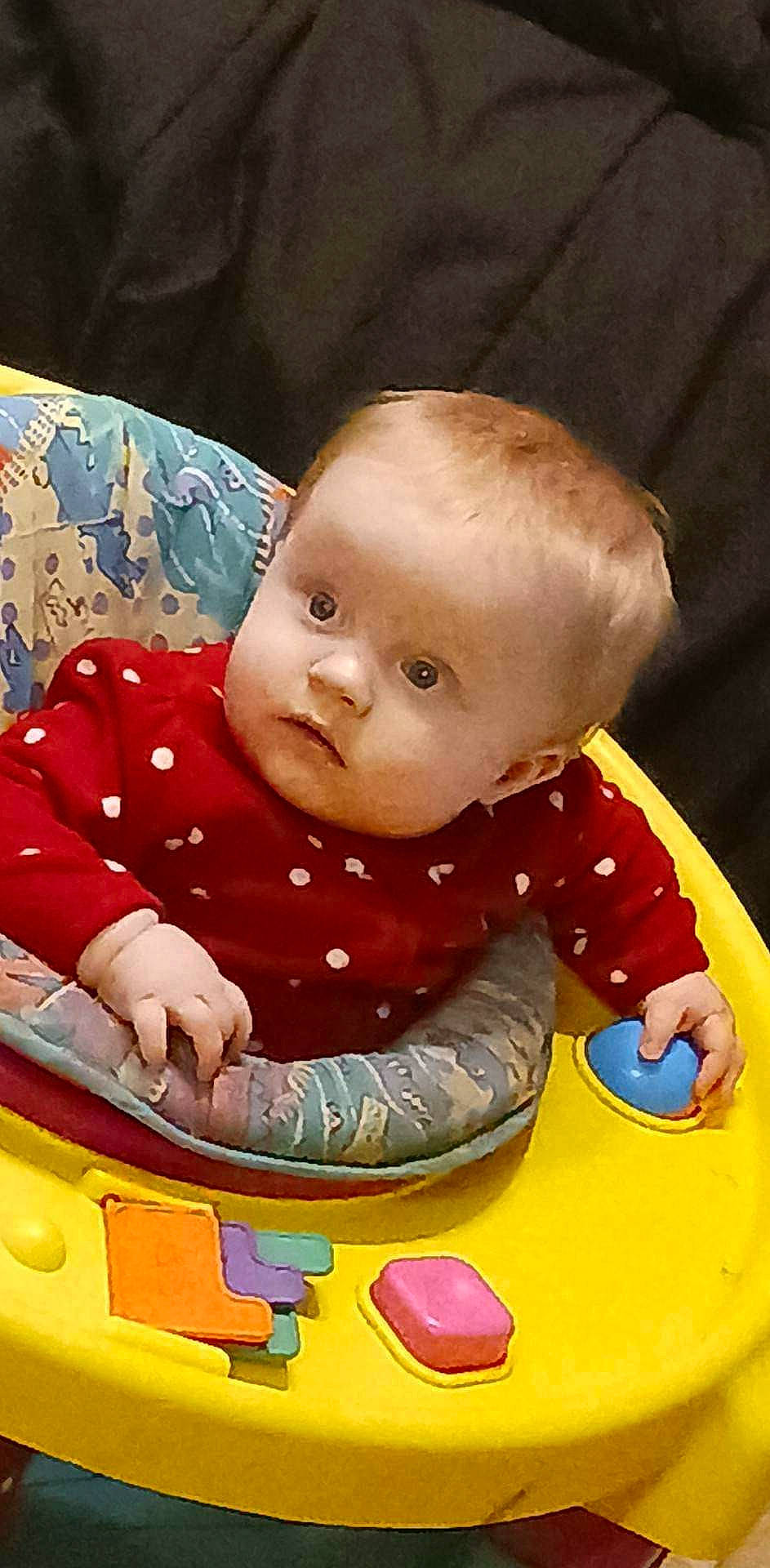 Raylynn is registered to the contest to win money with this photo: arm, baby, baby_playing_with_toys, baby_products, baby_toddler_clothing, bib, cheek, child, eye, fun, hairstyle, happy, mouth, nose, person, play, sitting, skin, sleeve, toddler