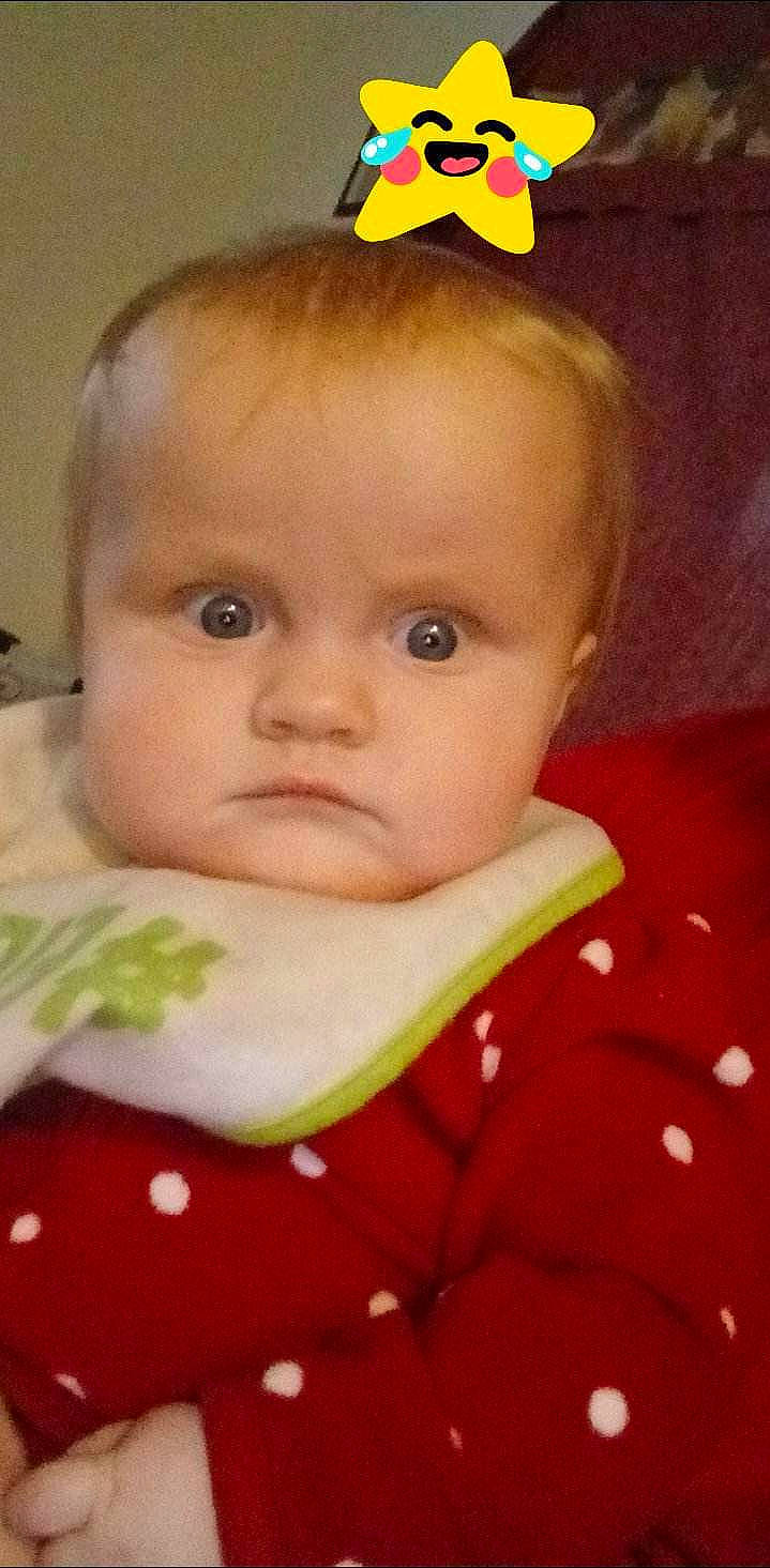 Raylynn joined the competition — help win amazing prizes! baby, baby_products, baby_toddler_clothing, bib, cheek, child, eyebrow, eyelash, face, hairstyle, happy, iris, lip, nose, person, petal, sitting, skin, sleeve, toddler