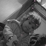 Sophie participe au concours pour gagner de l'argent avec cette photo : animation, black_and_white, blanket, casual, child, couch, cozy, cute, face, furniture, hair, hoodie, indoor, portrait, room, sitting, sparkle_filter, television, toddler, toy