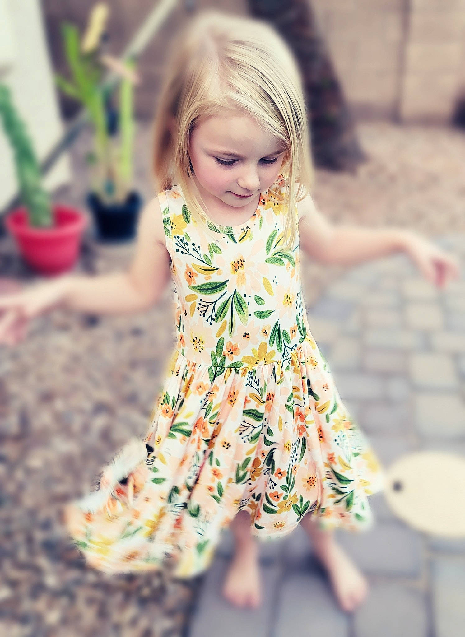 Maci is registered to the contest to win money with this photo: baby_toddler_clothing, day_dress, dress, eye, flowerpot, grass, hair, hairstyle, happy, houseplant, one_piece_garment, people_in_nature, person, photograph, pink, plant, shoulder, sleeve, smile, street_fashion