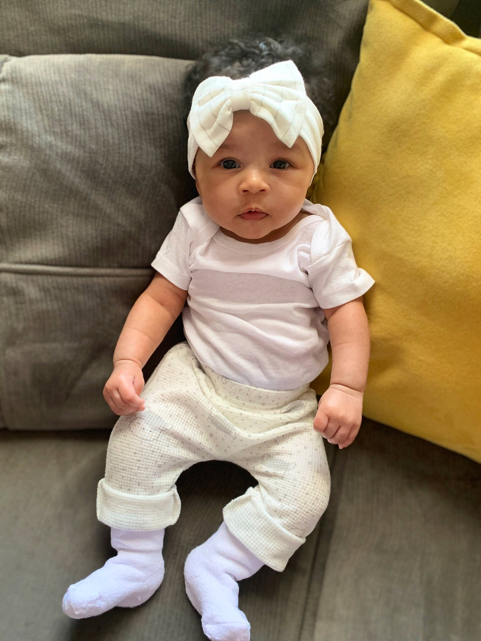 Isadora joined the competition — help win amazing prizes! baby, baby_toddler_clothing, child, collar, comfort, couch, flooring, happy, hat, headwear, linens, pattern, person, portrait_photography, sitting, sleeve, sock, t_shirt, toddler, white