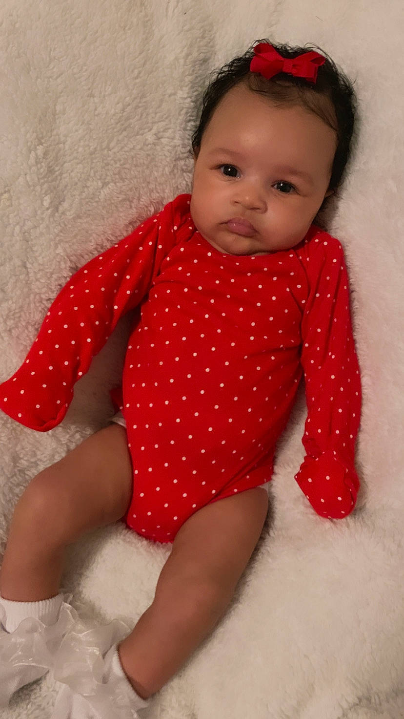 Isadora joined the competition — help win amazing prizes! baby_toddler_clothing, chin, dress, eye, face, finger, hair, hairstyle, hand, head, human_body, leg, lip, neck, one_piece_garment, person, pink, skin, sleeve, textile