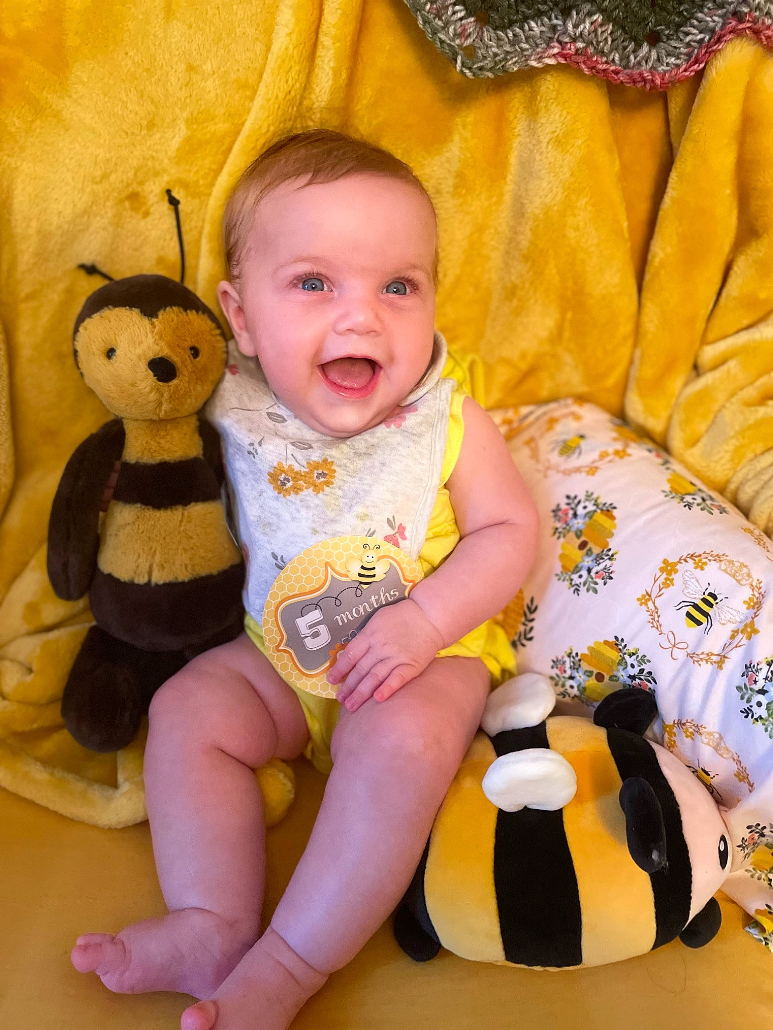 Della is registered to the contest to win money with this photo: baby, baby_toddler_clothing, cheek, child, comfort, eye, face, finger, happy, head, iris, organ, person, skin, sleeve, smile, textile, thigh, toddler, toy
