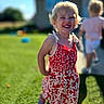 background, backyard, blonde_hair, child, family, floral_dress, girl, grass, happy, house, outdoor, playground, portrait, red_clothing, running, smiling, standing, summer, sunlight, toddler