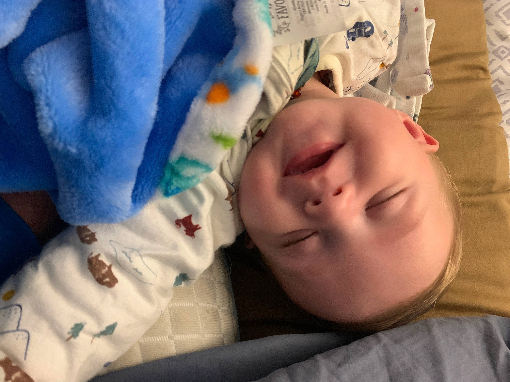 Bryce is registered to the contest to win money with this photo: baby, baby_products, baby_toddler_clothing, bedtime, cheek, child, comfort, eyelash, facial_expression, hand, happy, head, linens, mouth, nose, person, product, skin, textile, toddler