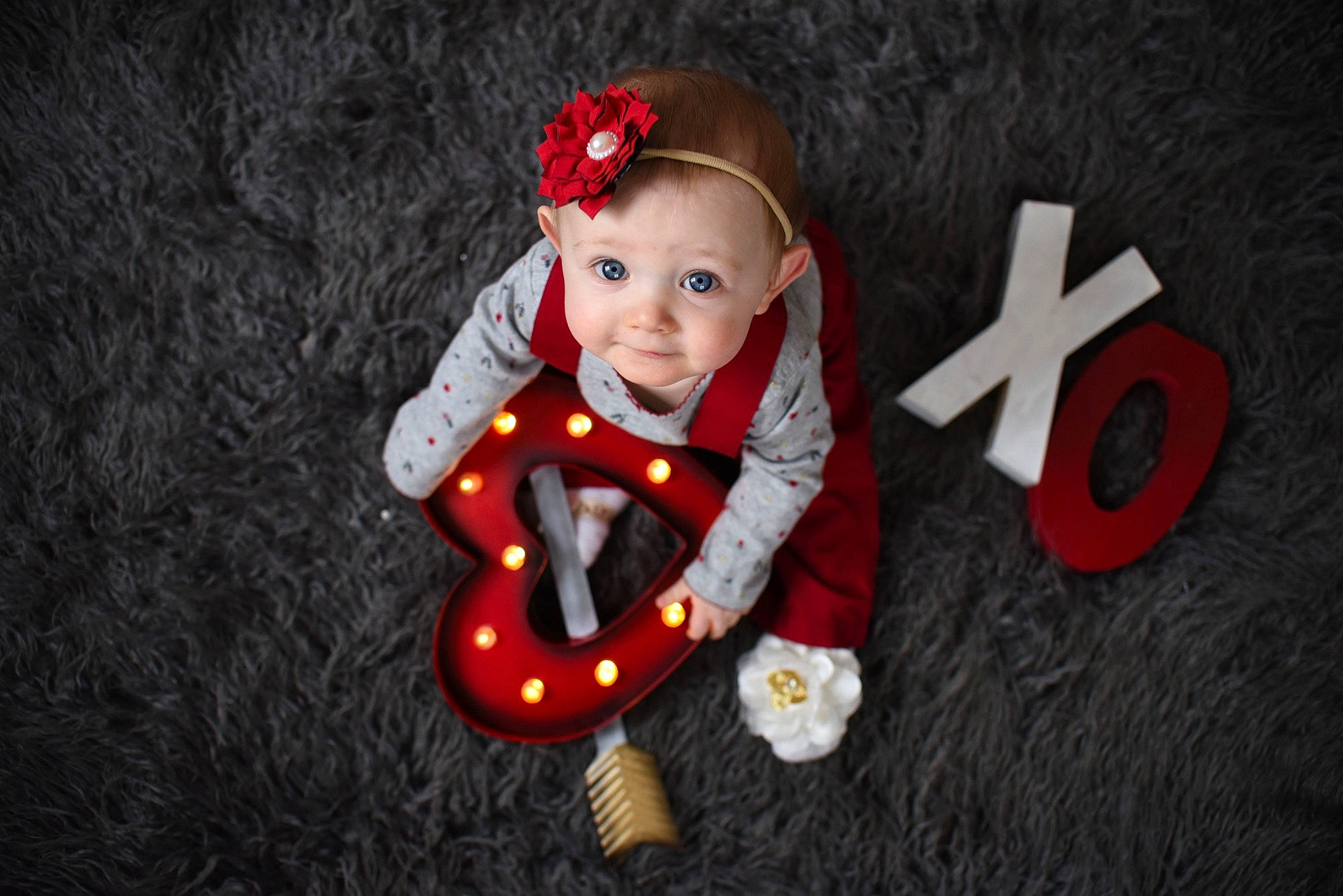 Leyla is registered to the contest to win money with this photo: child, person, photography, red, sitting, smile, toddler