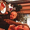 Baby joined the competition — help win amazing prizes! child, woman, pizza, plate, water_bottle, table, window, plant, indoor, smile, food, drink, face, hair, clothing, napkin, snow, daylight, happy, restaurant